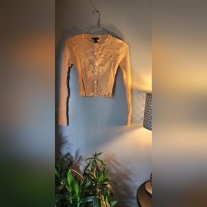 FOREVER 21 long sleeve orange cardigan button up with flower buttons.